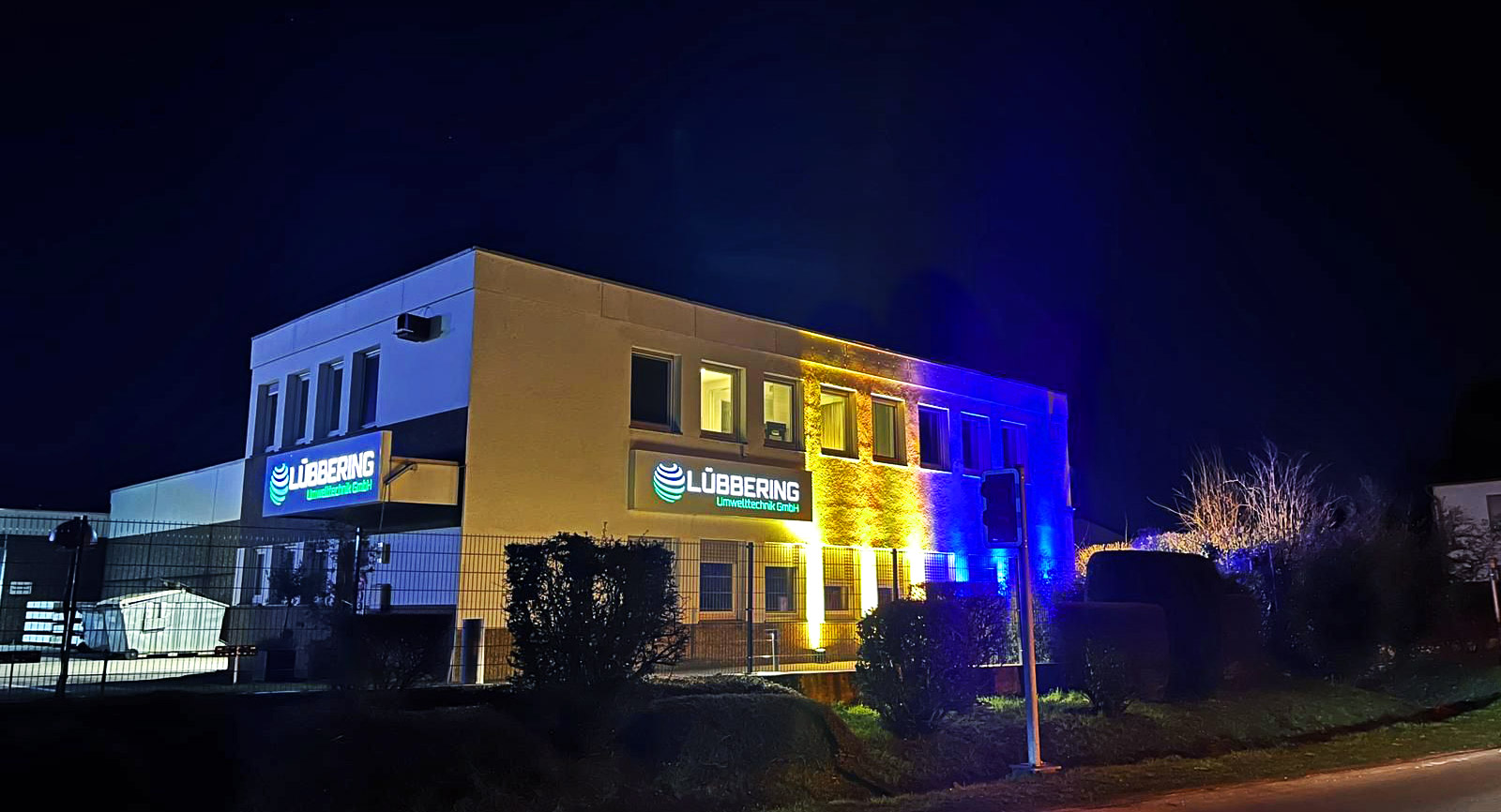 Company building illuminated in the colors of the Ukrainian flag